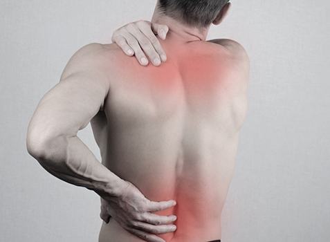 Man with back pain, may benefit from myofascial release