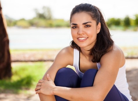 Woman smiling after health and fitness counseling session